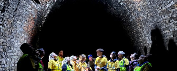 Participants in Kelmarsh Tunnel looking up at the light.