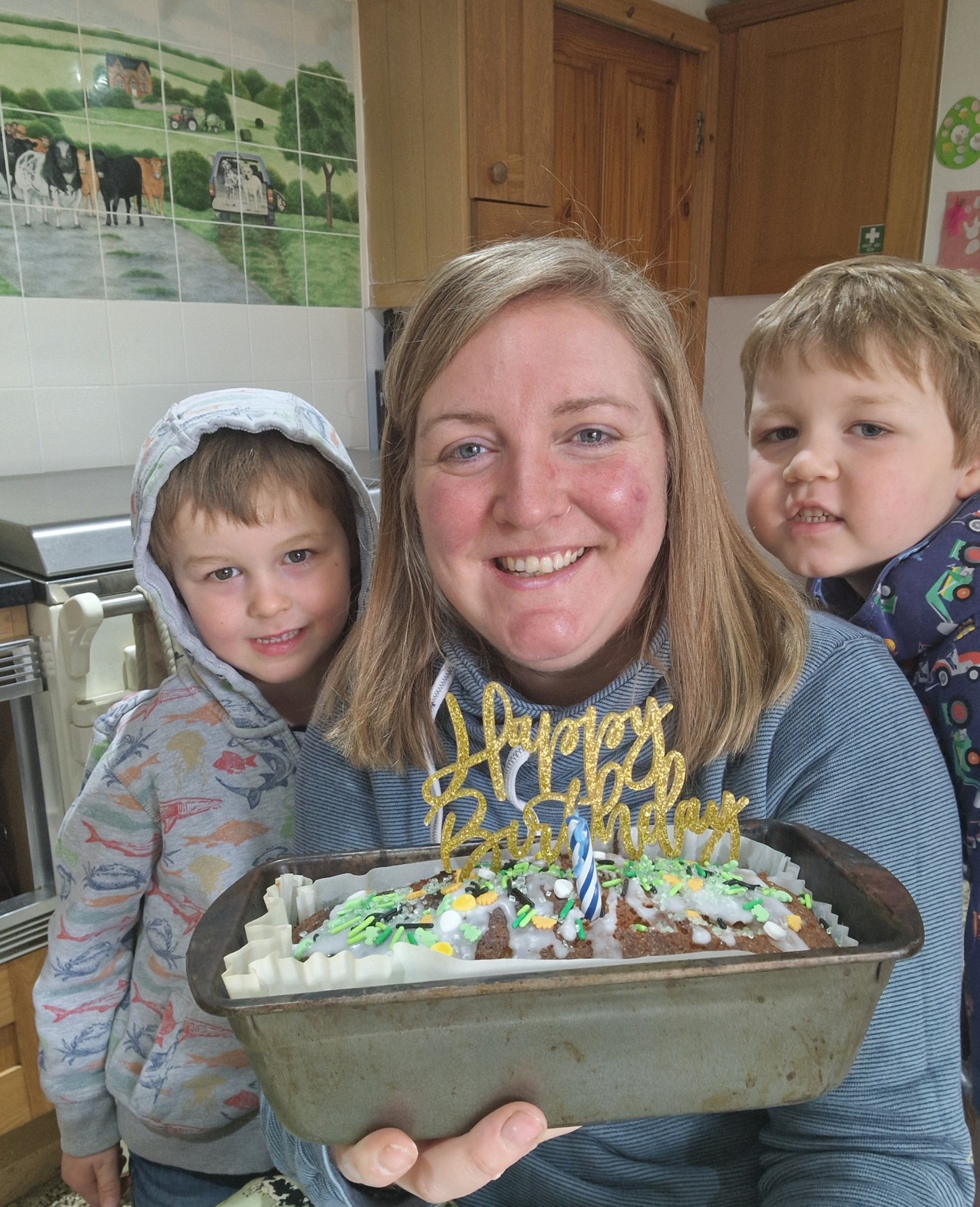 Milly Fyfe with sons and a 1st birthday cake
