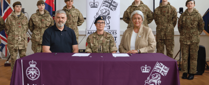 Wills Consultants cofounders Simon Wills and Nikki Wills, sign the Armed Forces Covenant with The Hon Col LNR, Mandy Davanna.