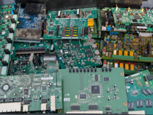 a pile of recovered green circuit boards