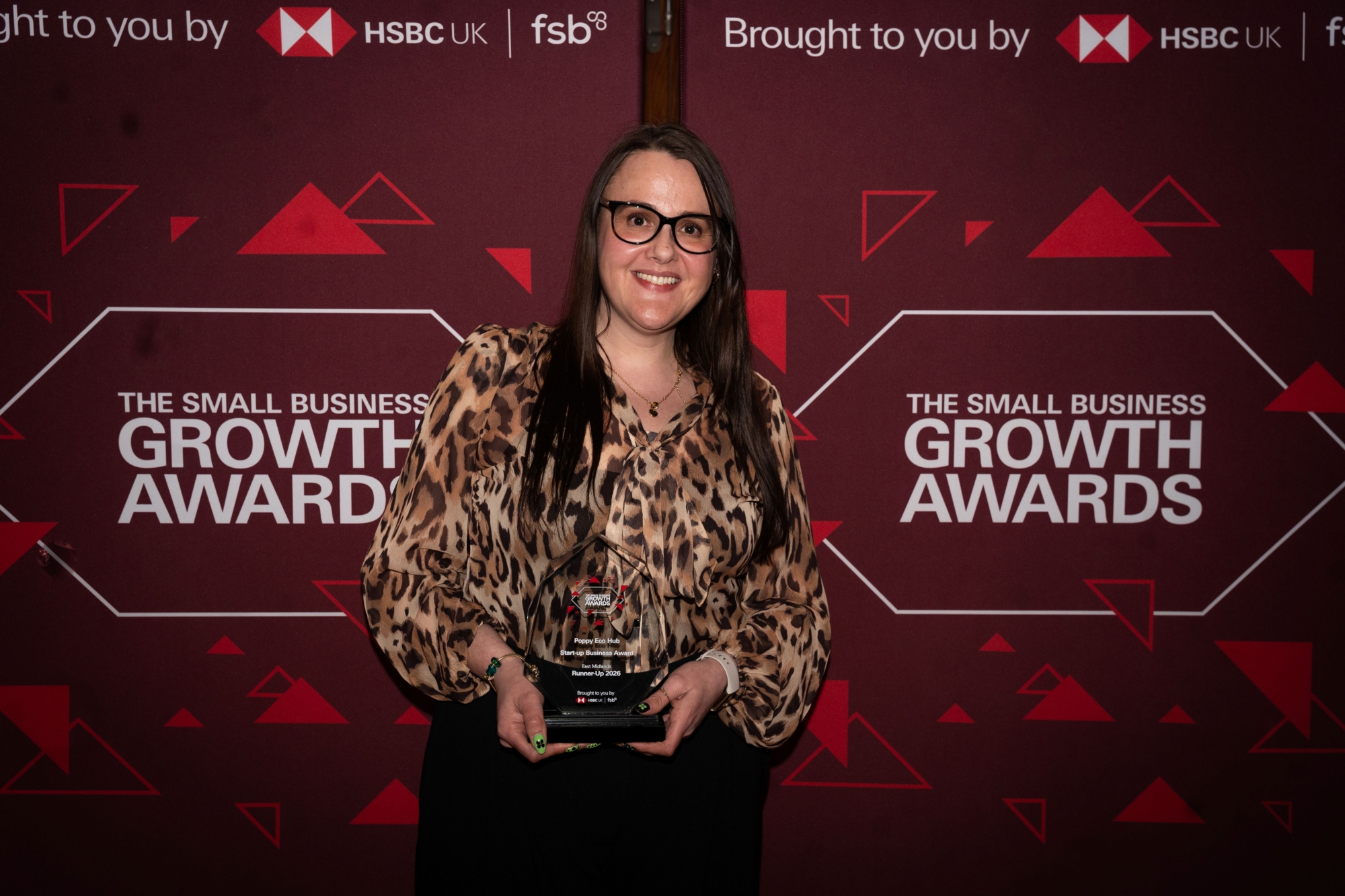 Marie Baker collects her award at the Small Business Growth Awards