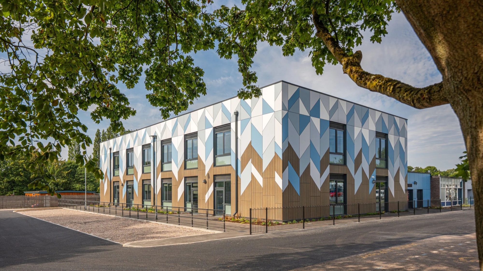 Precision panel fabrication creates a bold geometric façade for Sherbourne Fields School | Northamptonshire Chamber of Commerce