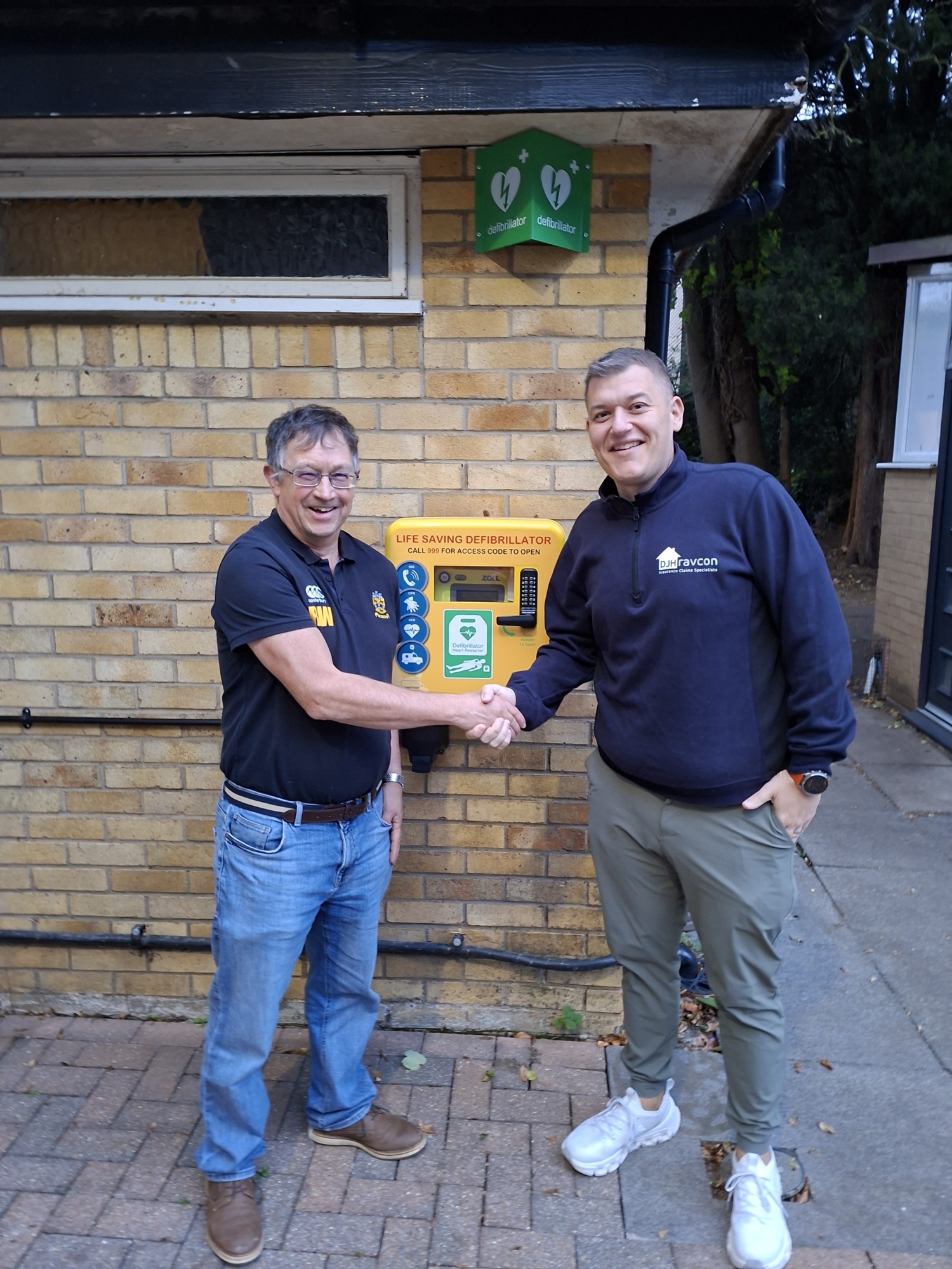 The heartbeat of the community – life-saving defibrillator installed, thanks to DJH Ravcon | Northamptonshire Chamber of Commerce